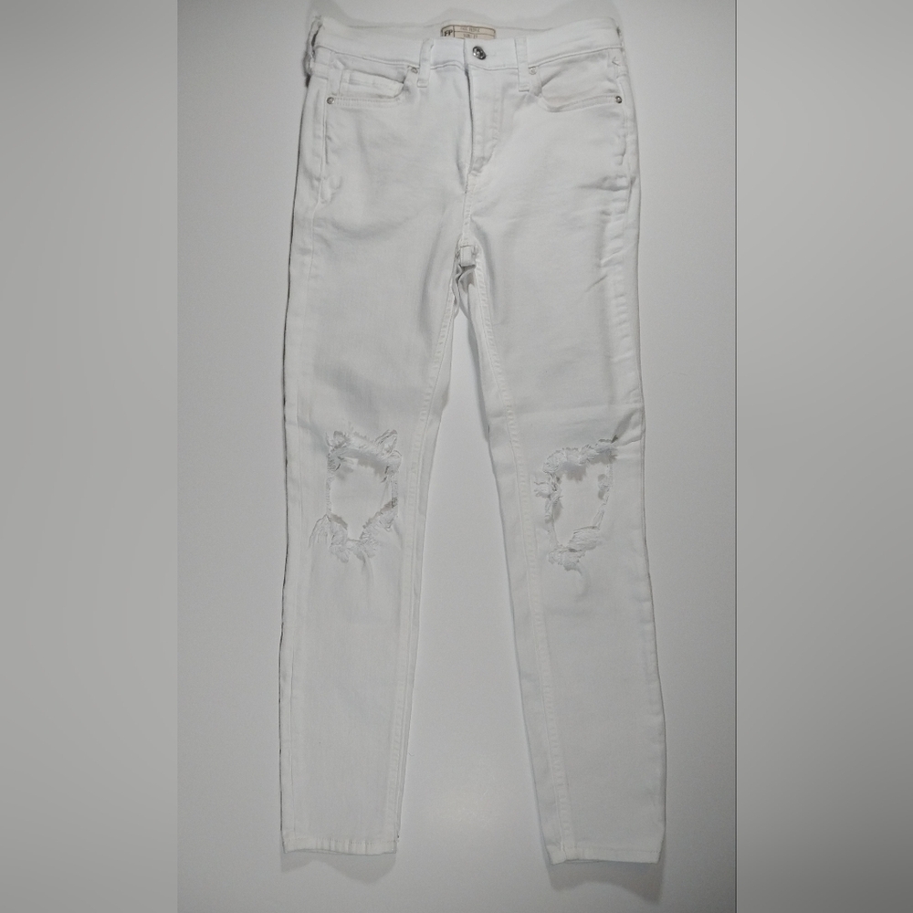 Free People women's size 27 white distressed jeans.